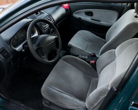 Зелений Міцубісі Харизма, об'ємом двигуна 1.6 л та пробігом 357 тис. км за 1499 $, фото 3 на Automoto.ua