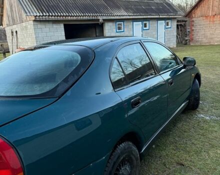 Зеленый Мицубиси Харизма, объемом двигателя 1 л и пробегом 475 тыс. км за 1299 $, фото 2 на Automoto.ua