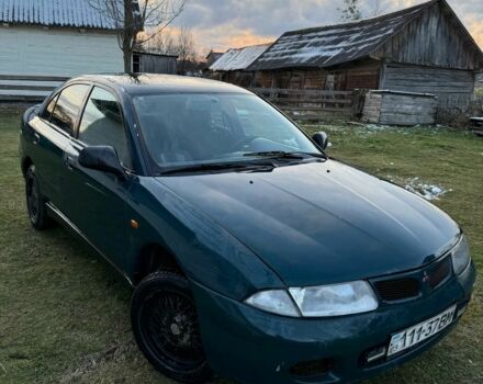 Зеленый Мицубиси Харизма, объемом двигателя 1 л и пробегом 475 тыс. км за 1299 $, фото 1 на Automoto.ua