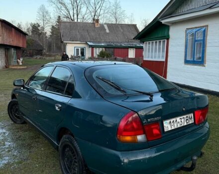 Зеленый Мицубиси Харизма, объемом двигателя 1 л и пробегом 475 тыс. км за 1299 $, фото 3 на Automoto.ua