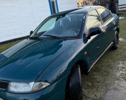 Зеленый Мицубиси Харизма, объемом двигателя 1 л и пробегом 475 тыс. км за 1299 $, фото 4 на Automoto.ua