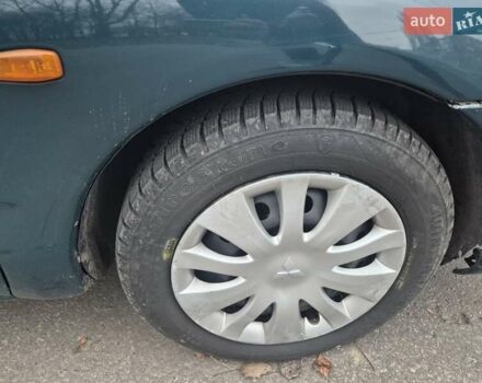 Зелений Міцубісі Харизма, об'ємом двигуна 1.8 л та пробігом 621 тис. км за 1399 $, фото 7 на Automoto.ua