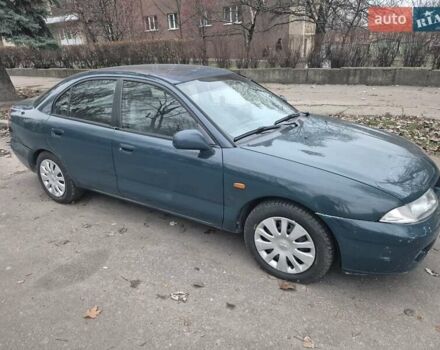 Зелений Міцубісі Харизма, об'ємом двигуна 1.8 л та пробігом 621 тис. км за 1399 $, фото 3 на Automoto.ua