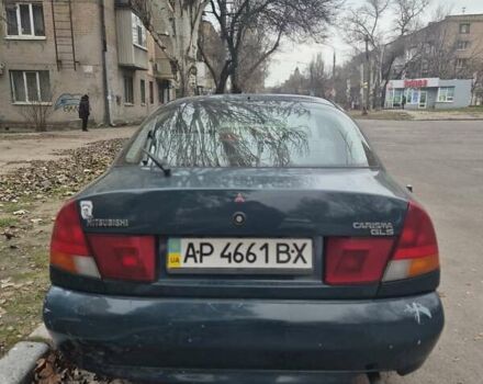 Зелений Міцубісі Харизма, об'ємом двигуна 1.8 л та пробігом 621 тис. км за 1399 $, фото 5 на Automoto.ua