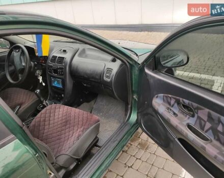 Зеленый Мицубиси Харизма, объемом двигателя 1.83 л и пробегом 255 тыс. км за 3500 $, фото 18 на Automoto.ua