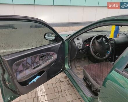 Зеленый Мицубиси Харизма, объемом двигателя 1.83 л и пробегом 255 тыс. км за 3500 $, фото 21 на Automoto.ua