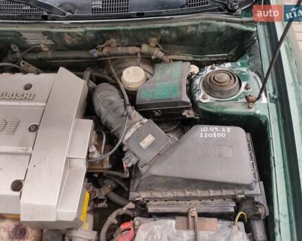 Зеленый Мицубиси Харизма, объемом двигателя 1.83 л и пробегом 255 тыс. км за 3500 $, фото 13 на Automoto.ua