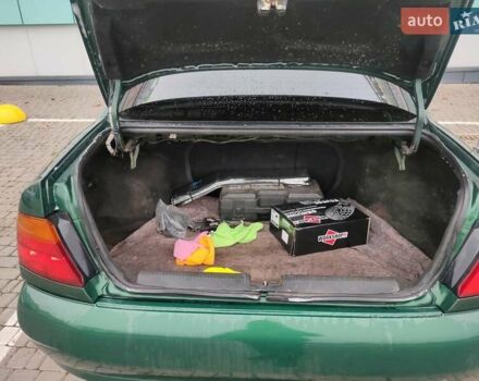 Зеленый Мицубиси Харизма, объемом двигателя 1.83 л и пробегом 255 тыс. км за 3500 $, фото 16 на Automoto.ua