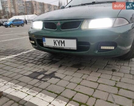 Зеленый Мицубиси Харизма, объемом двигателя 1.83 л и пробегом 255 тыс. км за 3500 $, фото 22 на Automoto.ua