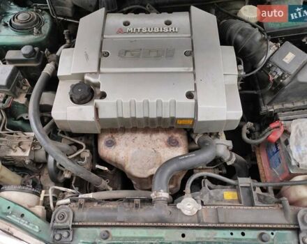 Зеленый Мицубиси Харизма, объемом двигателя 1.83 л и пробегом 255 тыс. км за 3500 $, фото 14 на Automoto.ua