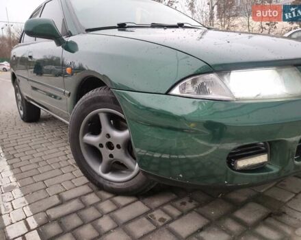 Зеленый Мицубиси Харизма, объемом двигателя 1.83 л и пробегом 255 тыс. км за 3500 $, фото 1 на Automoto.ua