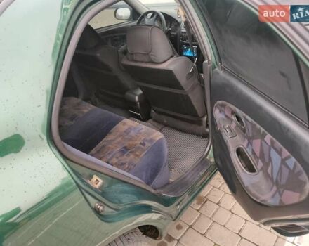 Зеленый Мицубиси Харизма, объемом двигателя 1.83 л и пробегом 255 тыс. км за 3500 $, фото 17 на Automoto.ua