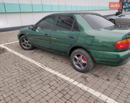 Зеленый Мицубиси Харизма, объемом двигателя 1.83 л и пробегом 255 тыс. км за 3500 $, фото 6 на Automoto.ua