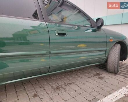 Зеленый Мицубиси Харизма, объемом двигателя 1.83 л и пробегом 255 тыс. км за 3500 $, фото 4 на Automoto.ua