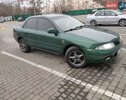 Зеленый Мицубиси Харизма, объемом двигателя 1.83 л и пробегом 255 тыс. км за 3500 $, фото 2 на Automoto.ua