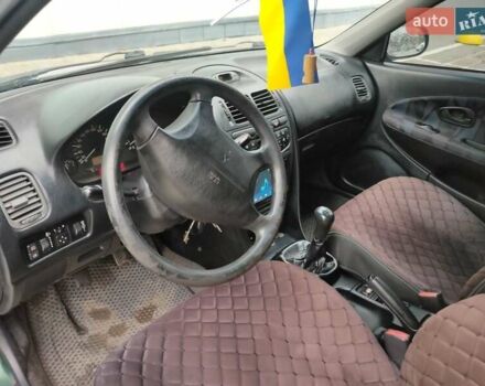 Зеленый Мицубиси Харизма, объемом двигателя 1.83 л и пробегом 255 тыс. км за 3500 $, фото 19 на Automoto.ua