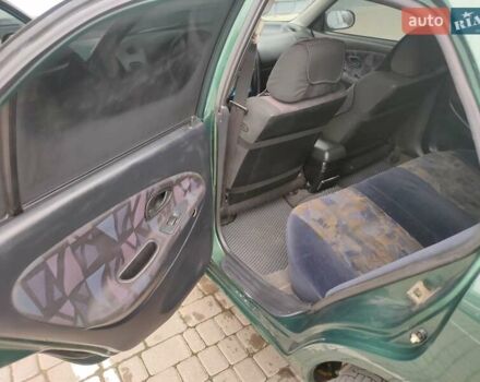 Зеленый Мицубиси Харизма, объемом двигателя 1.83 л и пробегом 255 тыс. км за 3500 $, фото 20 на Automoto.ua