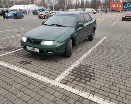 Зеленый Мицубиси Харизма, объемом двигателя 1.83 л и пробегом 255 тыс. км за 3500 $, фото 3 на Automoto.ua