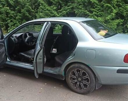 Зелений Міцубісі Харизма, об'ємом двигуна 1.6 л та пробігом 292 тис. км за 3200 $, фото 5 на Automoto.ua