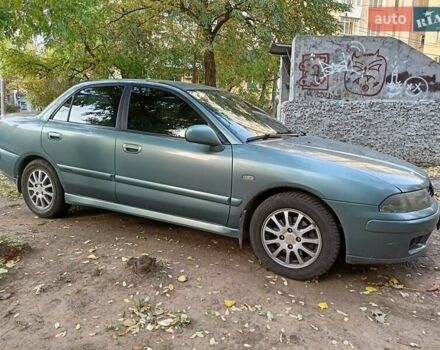 Зеленый Мицубиси Харизма, объемом двигателя 1.6 л и пробегом 281 тыс. км за 3900 $, фото 1 на Automoto.ua