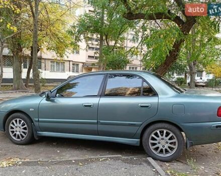 Зеленый Мицубиси Харизма, объемом двигателя 1.6 л и пробегом 281 тыс. км за 3900 $, фото 2 на Automoto.ua
