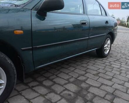 Зелений Міцубісі Харизма, об'ємом двигуна 1.6 л та пробігом 357 тис. км за 1399 $, фото 6 на Automoto.ua