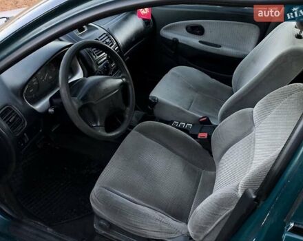 Зелений Міцубісі Харизма, об'ємом двигуна 1.6 л та пробігом 357 тис. км за 1499 $, фото 7 на Automoto.ua