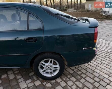 Зелений Міцубісі Харизма, об'ємом двигуна 1.6 л та пробігом 357 тис. км за 1499 $, фото 10 на Automoto.ua