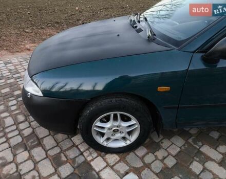 Зелений Міцубісі Харизма, об'ємом двигуна 1.6 л та пробігом 357 тис. км за 1499 $, фото 12 на Automoto.ua