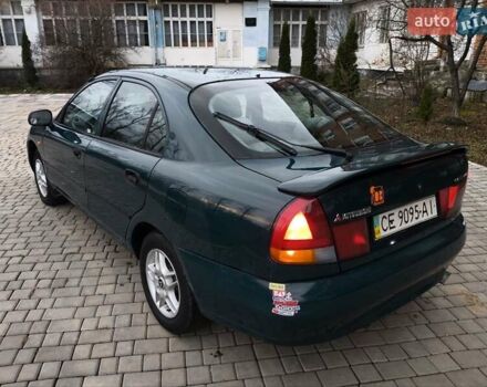 Зеленый Мицубиси Харизма, объемом двигателя 1.6 л и пробегом 357 тыс. км за 1480 $, фото 3 на Automoto.ua