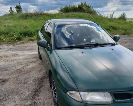 Зеленый Мицубиси Харизма, объемом двигателя 1.6 л и пробегом 399 тыс. км за 2300 $, фото 1 на Automoto.ua