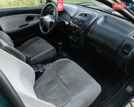 Зелений Міцубісі Харизма, об'ємом двигуна 1.6 л та пробігом 357 тис. км за 1499 $, фото 20 на Automoto.ua