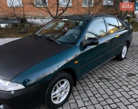 Зелений Міцубісі Харизма, об'ємом двигуна 1.6 л та пробігом 357 тис. км за 1499 $, фото 1 на Automoto.ua