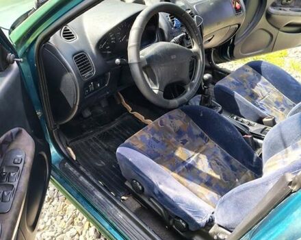 Зеленый Мицубиси Харизма, объемом двигателя 1.6 л и пробегом 399 тыс. км за 2300 $, фото 5 на Automoto.ua