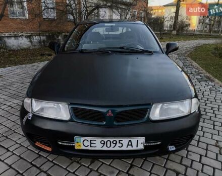 Зелений Міцубісі Харизма, об'ємом двигуна 1.6 л та пробігом 357 тис. км за 1499 $, фото 5 на Automoto.ua