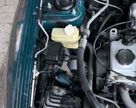 Зелений Міцубісі Харизма, об'ємом двигуна 1.6 л та пробігом 357 тис. км за 1399 $, фото 15 на Automoto.ua