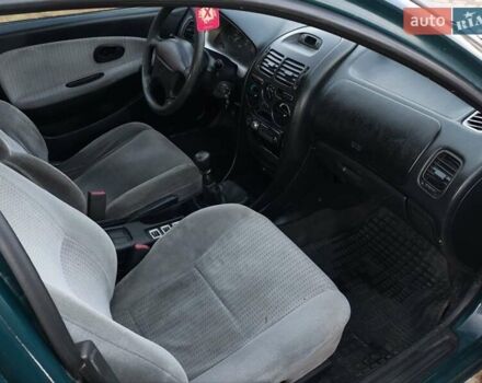 Зелений Міцубісі Харизма, об'ємом двигуна 1.6 л та пробігом 357 тис. км за 1499 $, фото 6 на Automoto.ua