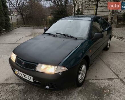 Зеленый Мицубиси Харизма, объемом двигателя 1.6 л и пробегом 357 тыс. км за 1480 $, фото 2 на Automoto.ua
