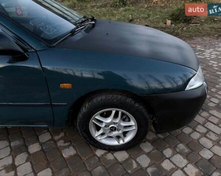 Зелений Міцубісі Харизма, об'ємом двигуна 1.6 л та пробігом 357 тис. км за 1499 $, фото 8 на Automoto.ua