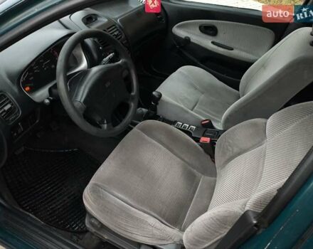 Зелений Міцубісі Харизма, об'ємом двигуна 1.6 л та пробігом 357 тис. км за 1399 $, фото 10 на Automoto.ua