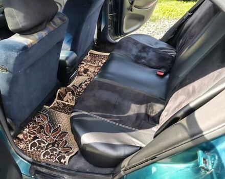 Зеленый Мицубиси Харизма, объемом двигателя 1.6 л и пробегом 399 тыс. км за 2300 $, фото 6 на Automoto.ua