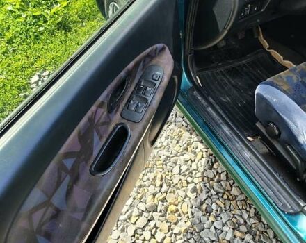 Зеленый Мицубиси Харизма, объемом двигателя 1.6 л и пробегом 399 тыс. км за 2300 $, фото 7 на Automoto.ua