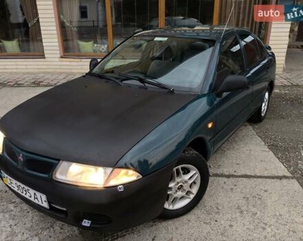 Зеленый Мицубиси Харизма, объемом двигателя 1.6 л и пробегом 357 тыс. км за 1480 $, фото 1 на Automoto.ua