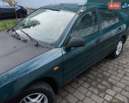 Зелений Міцубісі Харизма, об'ємом двигуна 1.6 л та пробігом 357 тис. км за 1399 $, фото 8 на Automoto.ua