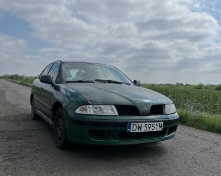 Зелений Міцубісі Харизма, об'ємом двигуна 1.9 л та пробігом 300 тис. км за 1429 $, фото 1 на Automoto.ua