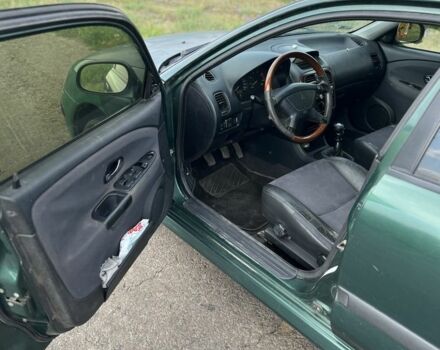 Зелений Міцубісі Харизма, об'ємом двигуна 1.9 л та пробігом 300 тис. км за 1429 $, фото 6 на Automoto.ua