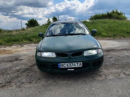 Зеленый Мицубиси Харизма, объемом двигателя 1.6 л и пробегом 399 тыс. км за 2300 $, фото 1 на Automoto.ua