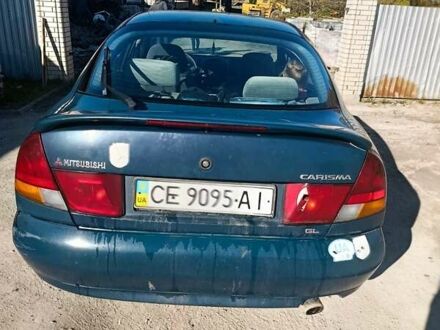 Зеленый Мицубиси Харизма, объемом двигателя 1.6 л и пробегом 350 тыс. км за 1250 $, фото 1 на Automoto.ua