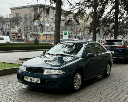 Зеленый Мицубиси Харизма, объемом двигателя 1.8 л и пробегом 320 тыс. км за 1650 $, фото 1 на Automoto.ua