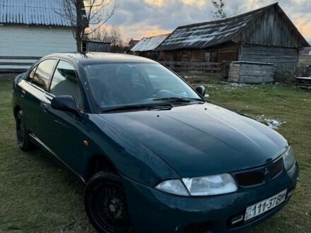 Зеленый Мицубиси Харизма, объемом двигателя 1 л и пробегом 475 тыс. км за 1299 $, фото 1 на Automoto.ua